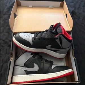 Nike Black and Gray Athletic Shoes with Red Accents